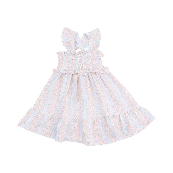 smocked dress with ruffle at the bottom of the dress. pink and blue stripe with the pink stripe being a floral. cross back straps 