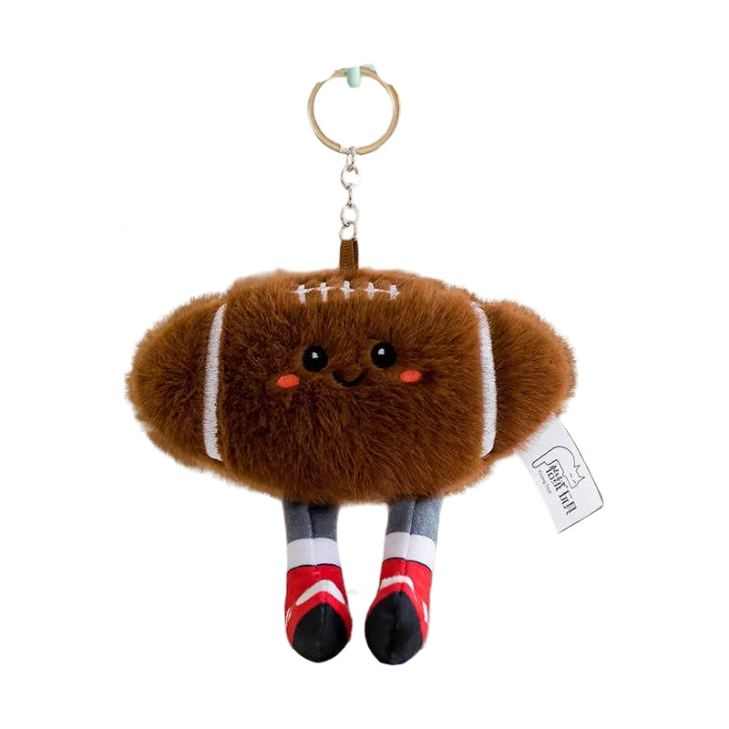 plush football keychain with a smiley face 