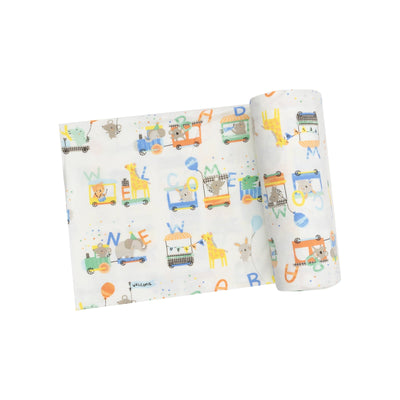 animal train print all over a soft white swaddle. 