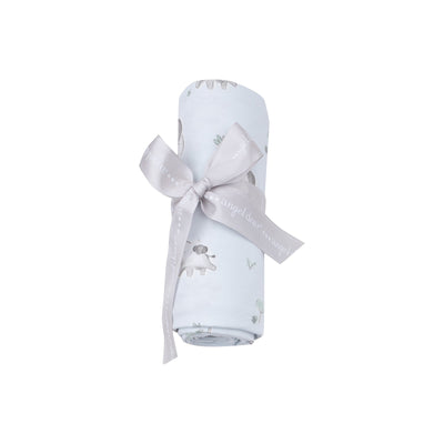 baby blue swaddle with baby elephants all over, swaddle rolled up with a ribbon the way that it will be packaged and sent to you