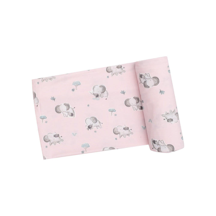 light pink baby swaddle with gray baby elephants all over it. 