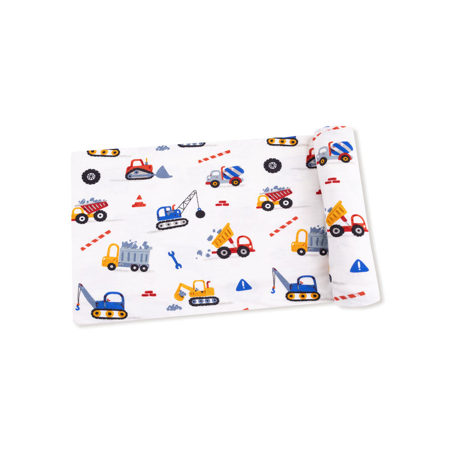 baby swaddle with construction vehicle pattern on a white background