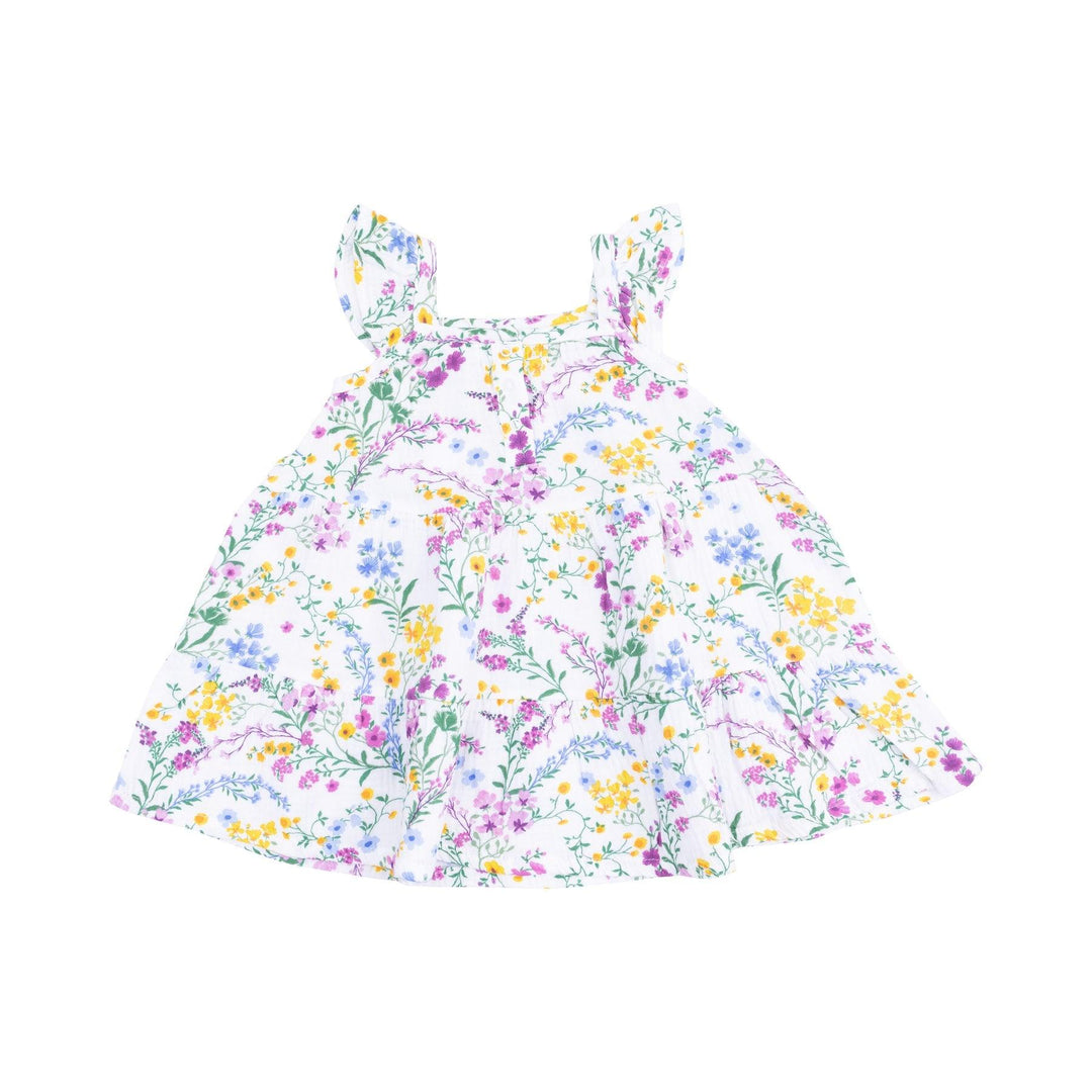 white dress with tiny yellow, purple, blue flowers, sleeveless dress with ruffles on the sleeve and big ruffle along the bottom. 