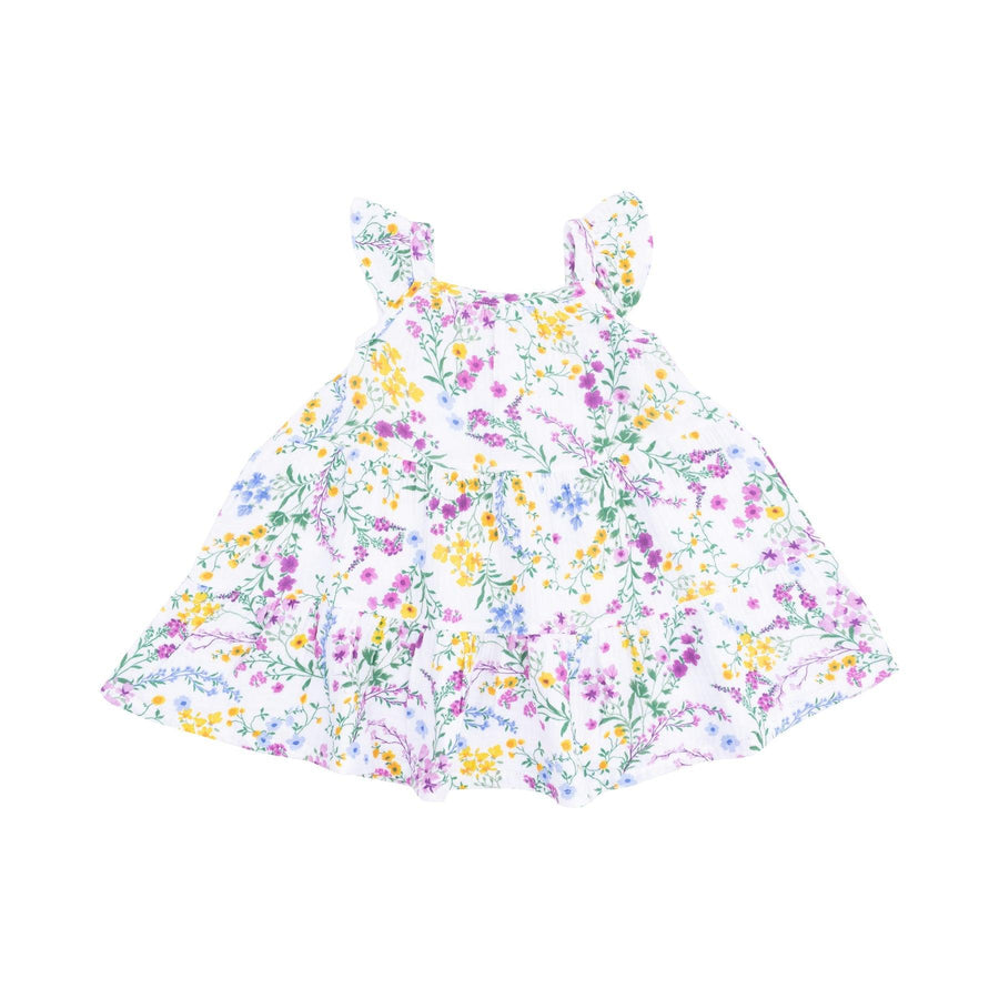 white sundress with tiny purple, yellow and blue flowers. slight ruffle on the sleeves, ruffle along the bottom. 