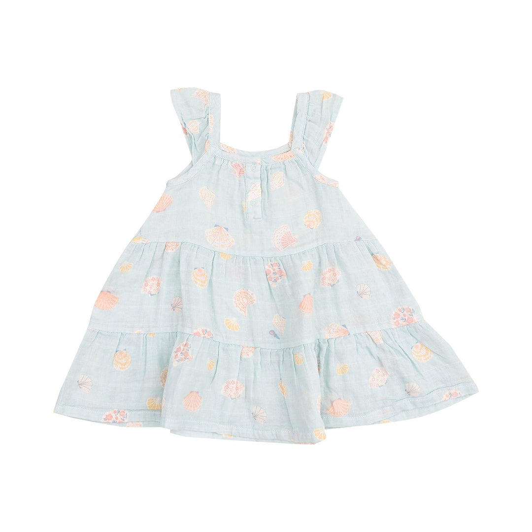 back of dress with 3 snaps at the top of the neck slight ruffle on the sleeves. A-line dress. ice blue with beige/peach seashells all over. 