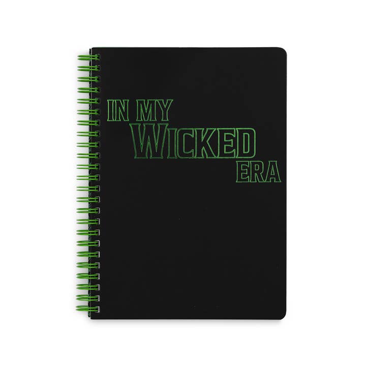 cover of a spiral bound notebook. black cover with green spine. The cover of the notebook reads: "In My Wicked Era" 