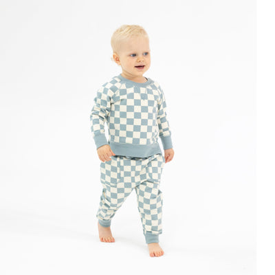 baby boy modeling checkerboard teal gray color and ivory. 