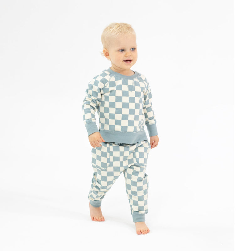 baby boy modeling checkerboard teal gray color and ivory. 