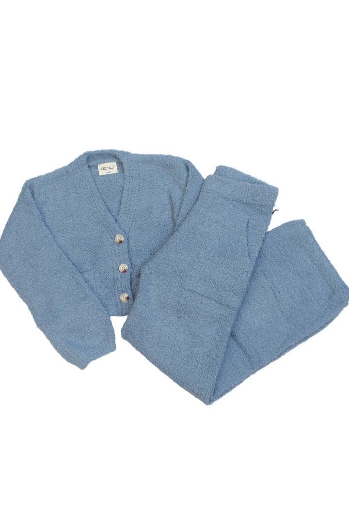 Blue textured cardigan and pants set on a white background
