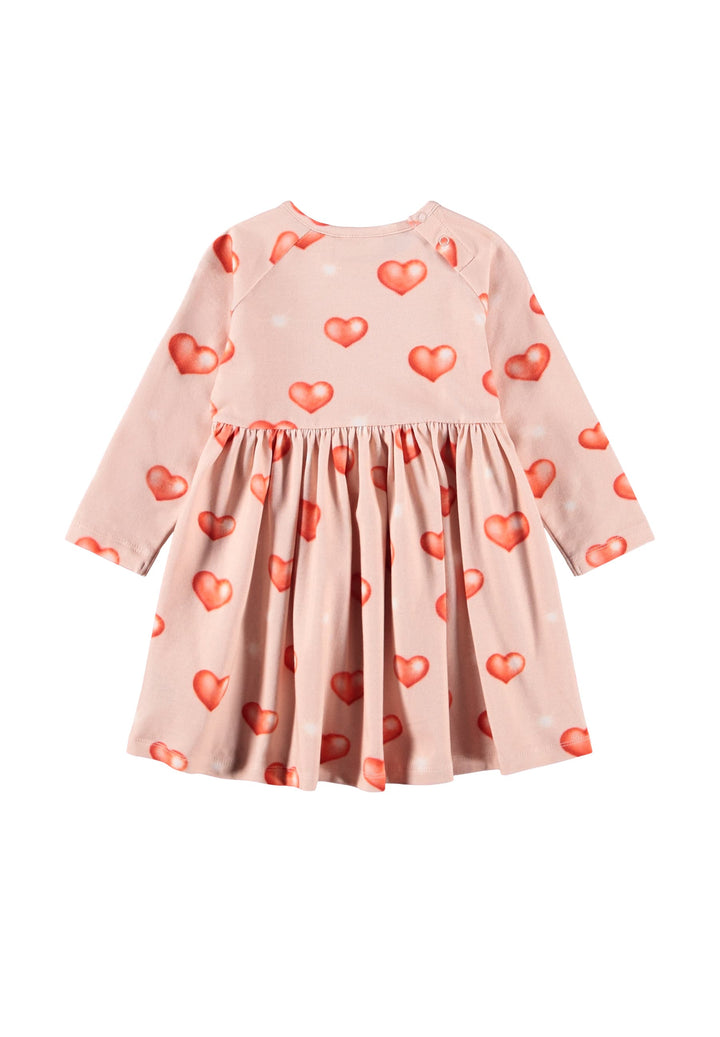 Pink dress with heart patterns on a white background