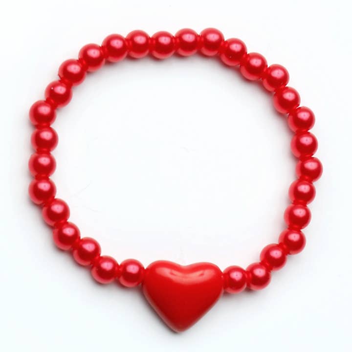 beaded red bracelet with a simple red heart at the center of the bracelet