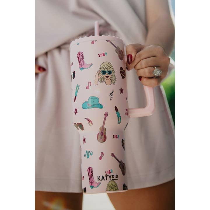 another picture of a woman holding the Taylor Swift tumbler 