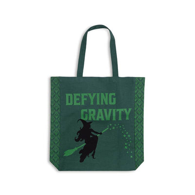 hunter green canvas tote with emerald green screening on the front and Elphaba on a broom. Wicked theme tote bag