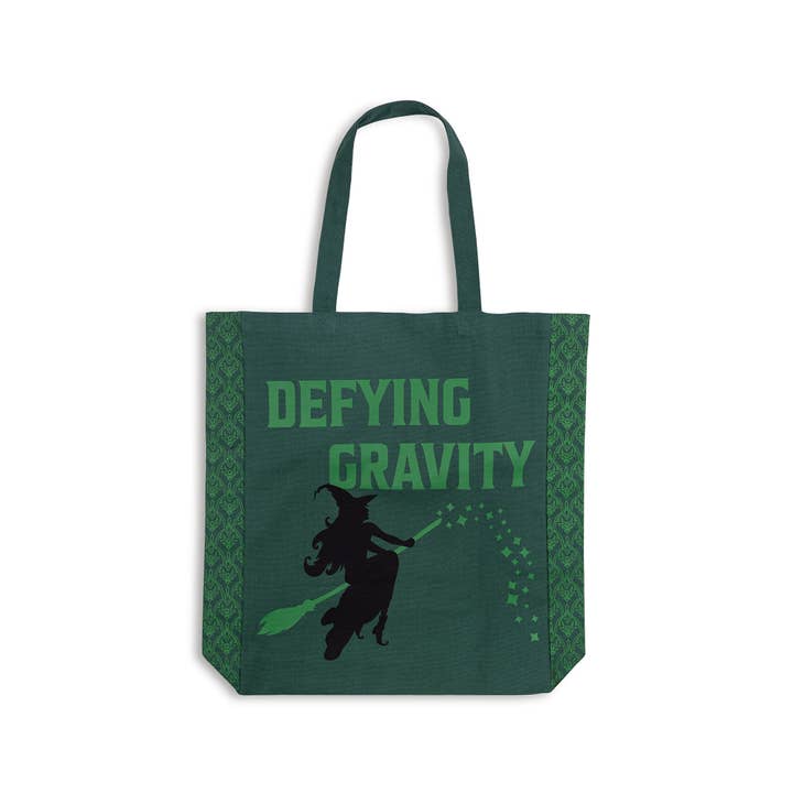 hunter green canvas tote with emerald green screening on the front and Elphaba on a broom. Wicked theme tote bag