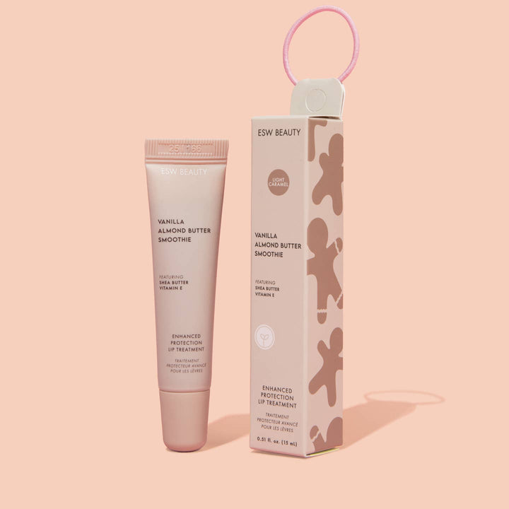 Vanilla Almond Butter Smoochie lip balm and packaging on a pink background
