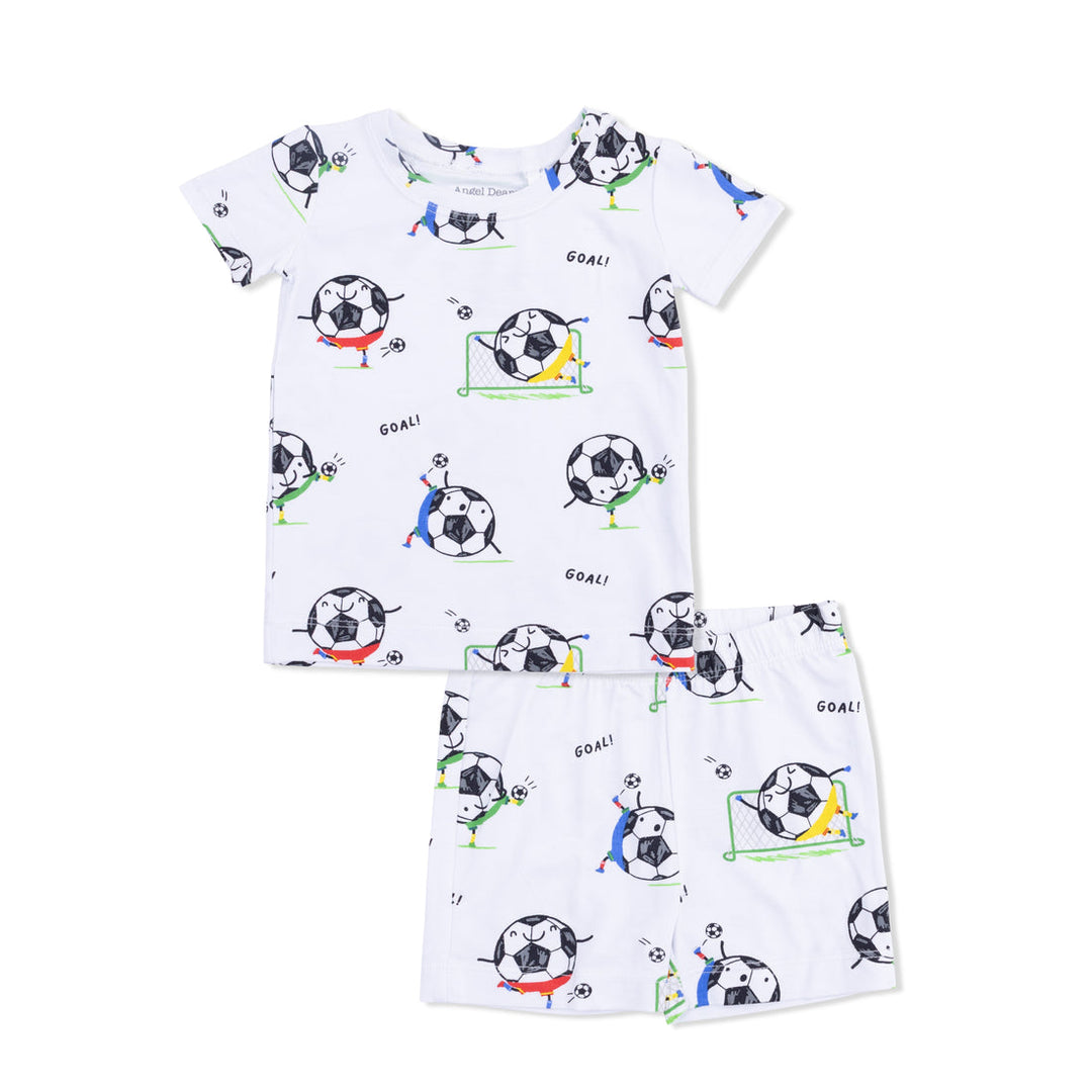 Children's pajama set with soccer ball pattern on a white background