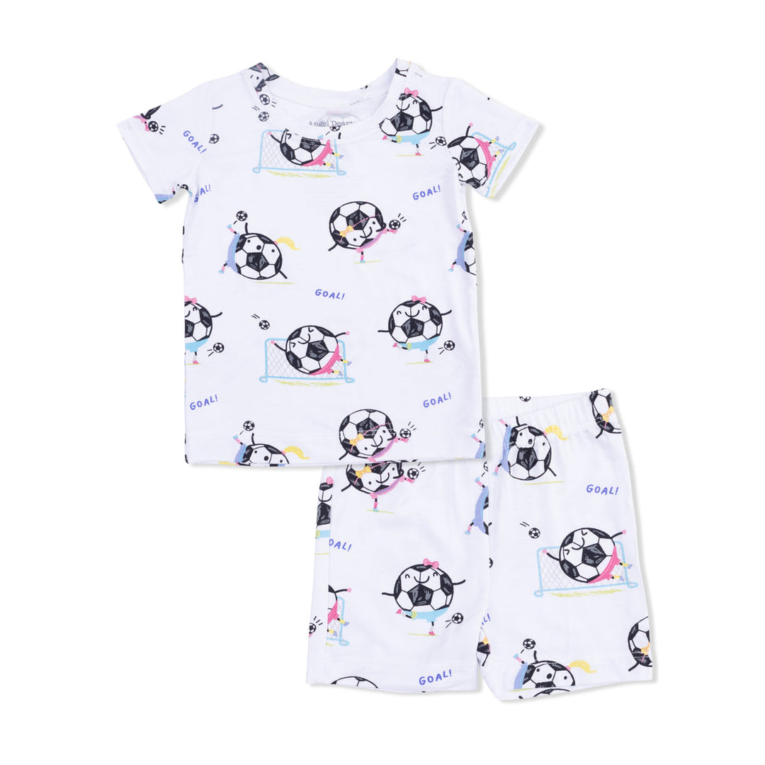 Children's pajama set with soccer ball and dog pattern on a white background