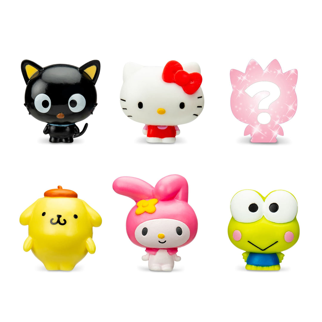 Set of colorful Hello Kitty cartoon figurines on a white background