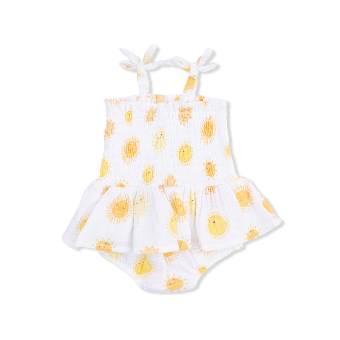 White romper with yellow sun pattern on a white background