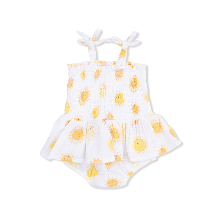 White romper with yellow sun pattern on a white background