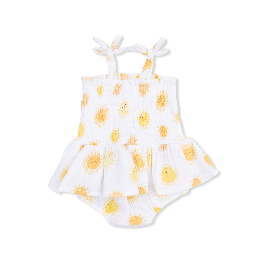 White romper with yellow sun pattern on a white background