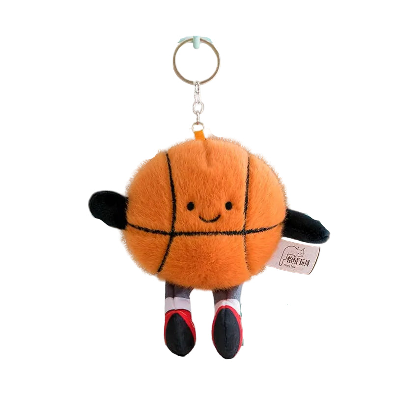 Plush basketball keychain with a smiling face on a stand