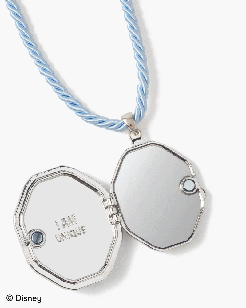 inside the locket of two mirrors and an engraving that says 'I am Unique' 