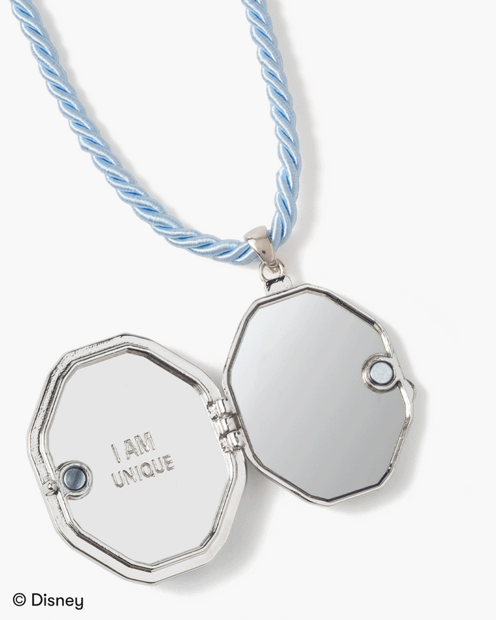 inside the locket of two mirrors and an engraving that says 'I am Unique' 