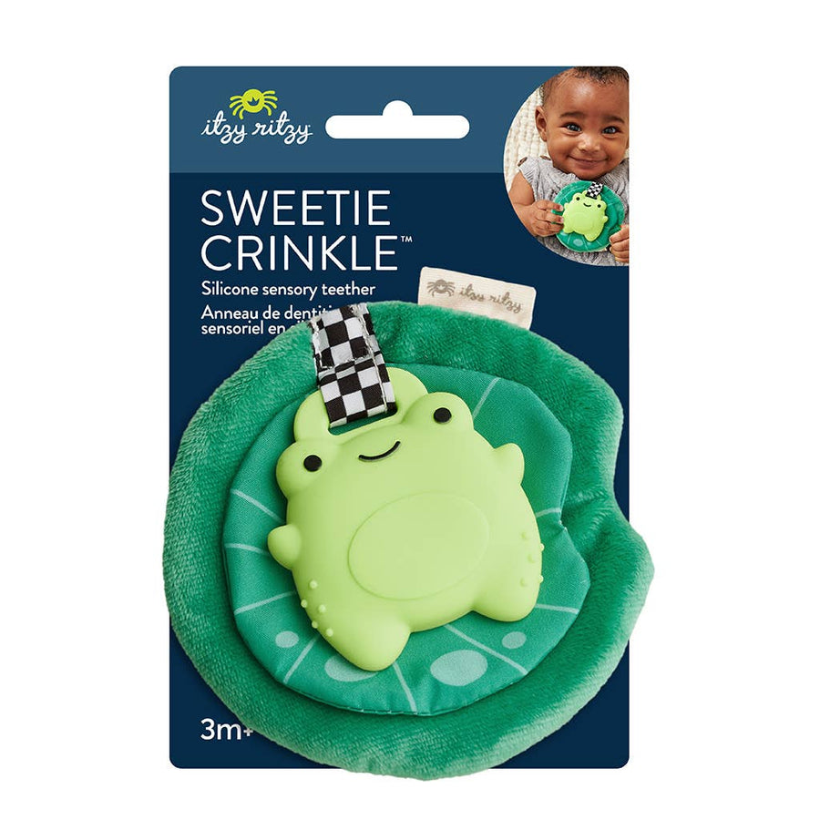 Green frog silicone sensory teether with crinkle sound on its packaging, featuring the brand 'itzzy ritzy'.