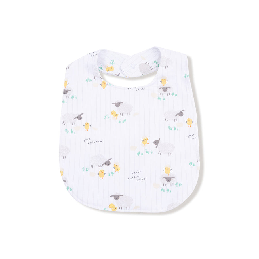 Baby bib with chick and lamb pattern on a white background