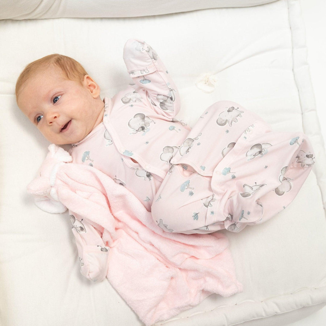 pink bundle gown with gray elephants all over  modeled by a sweet baby girl