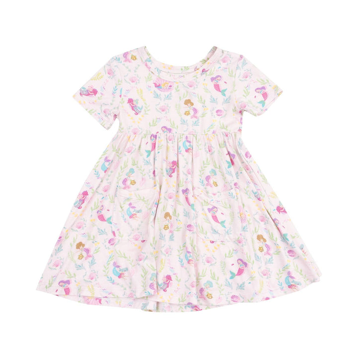short sleeve twirl dress with pockets on the front and tiny mermaids all over the dress in different pastel colors. mostly shades of pink and purple. 