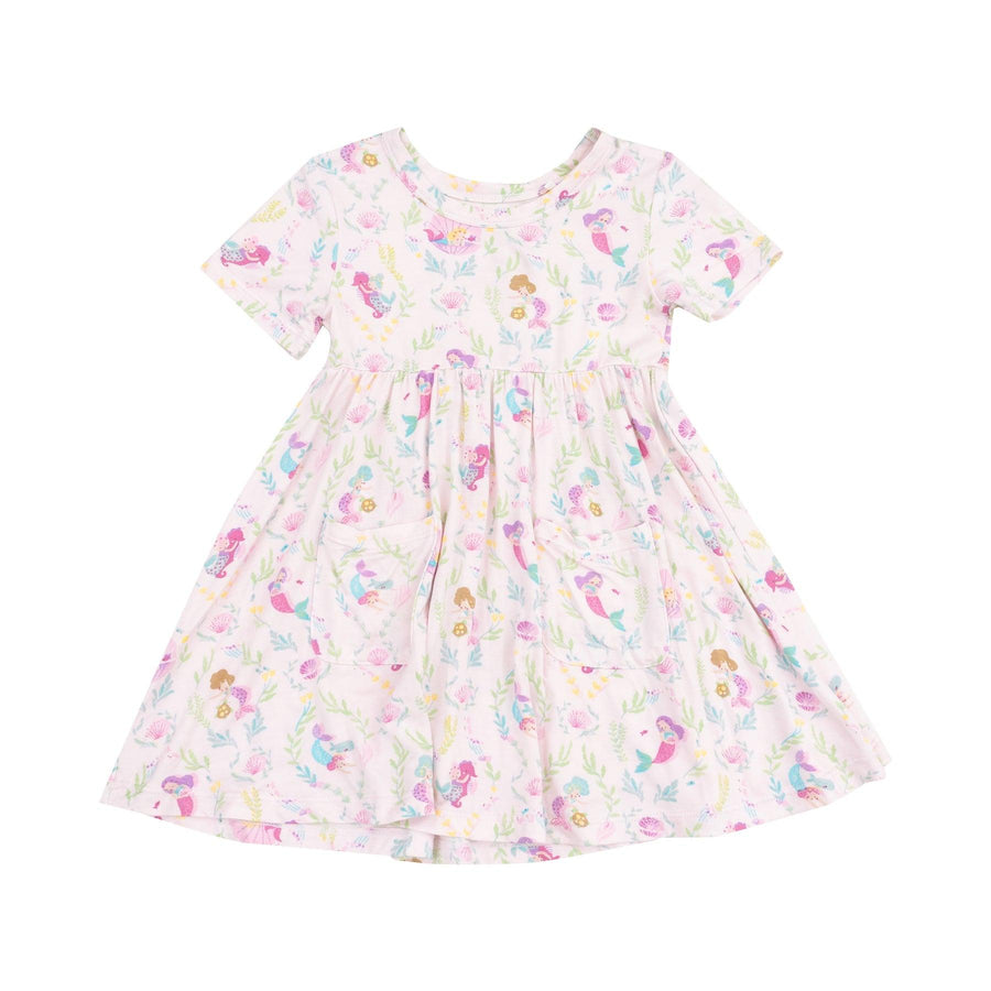 short sleeve twirl dress with pockets on the front and tiny mermaids all over the dress in different pastel colors. mostly shades of pink and purple. 