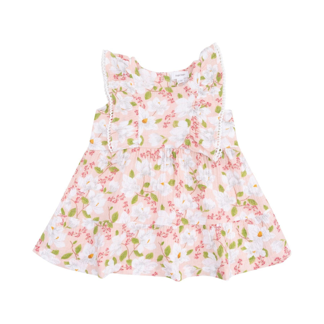 girls dress with white magnolia print and picot ruffles vertically to the waist. ruffle at the bottom. 