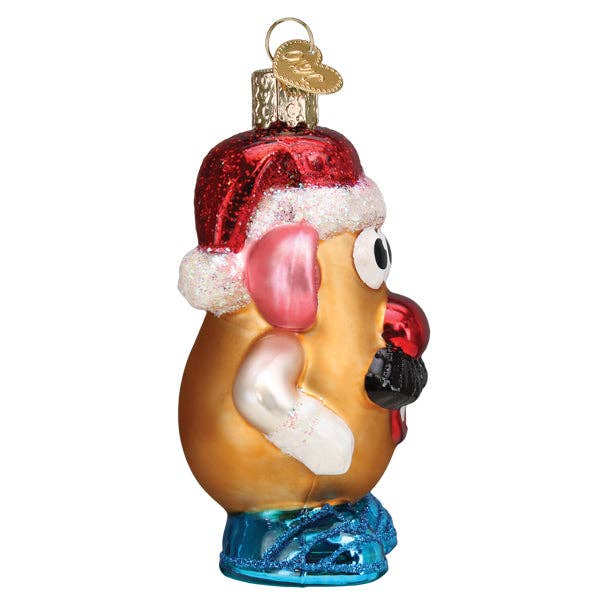 Glass ornament of a cartoon character wearing a Santa hat on a white background