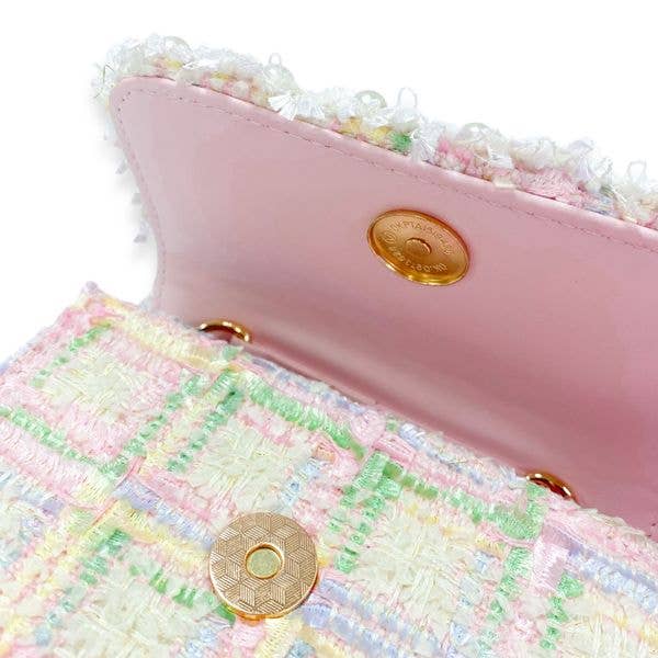 the inside of the flap with pink faux leather lining and a close up of the pastel tweed and magnetic closure