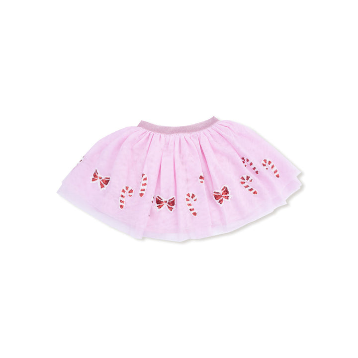 Pink tutu skirt with red bow and candy cane patterns on a white background