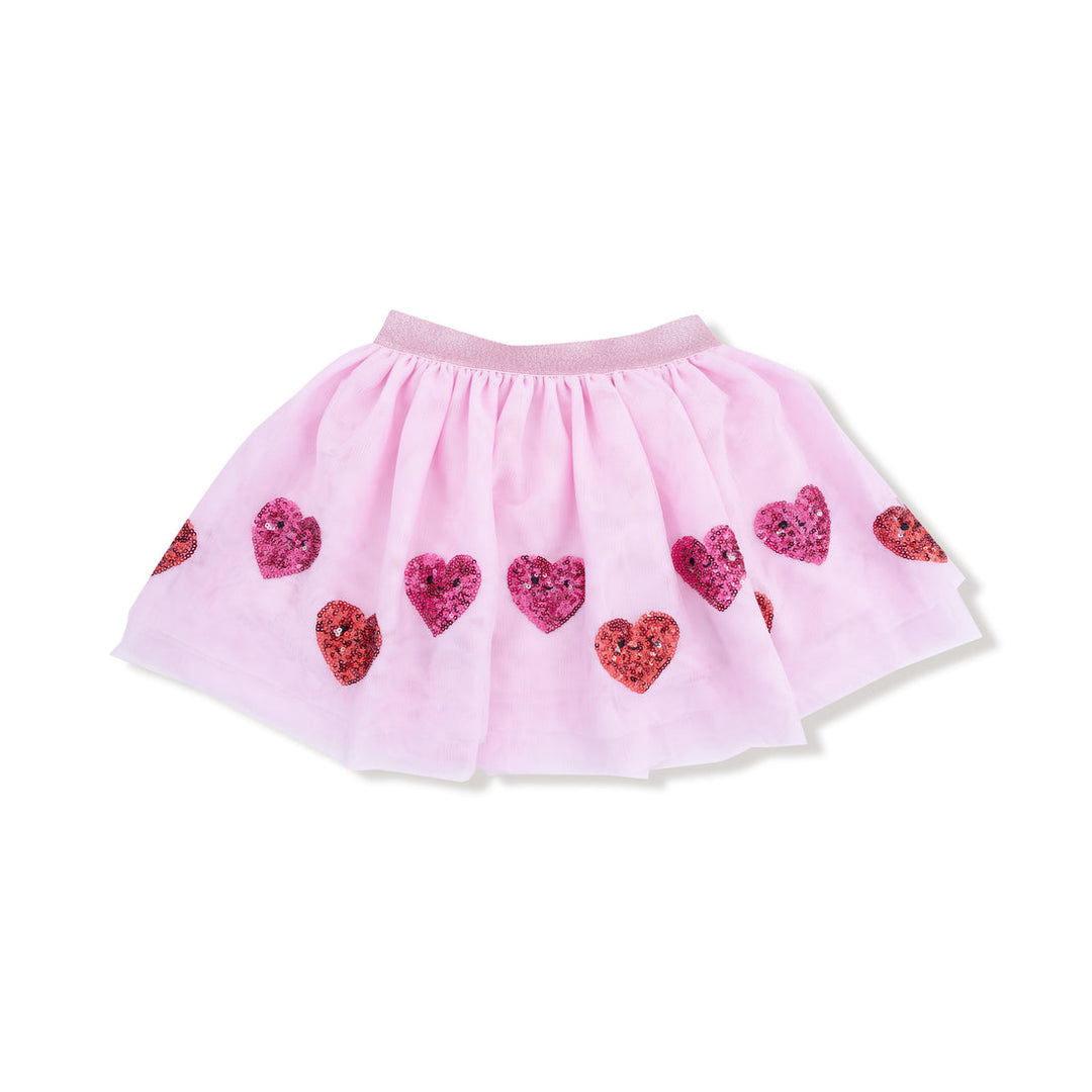 Pink tutu skirt with sequin heart patterns on a white background