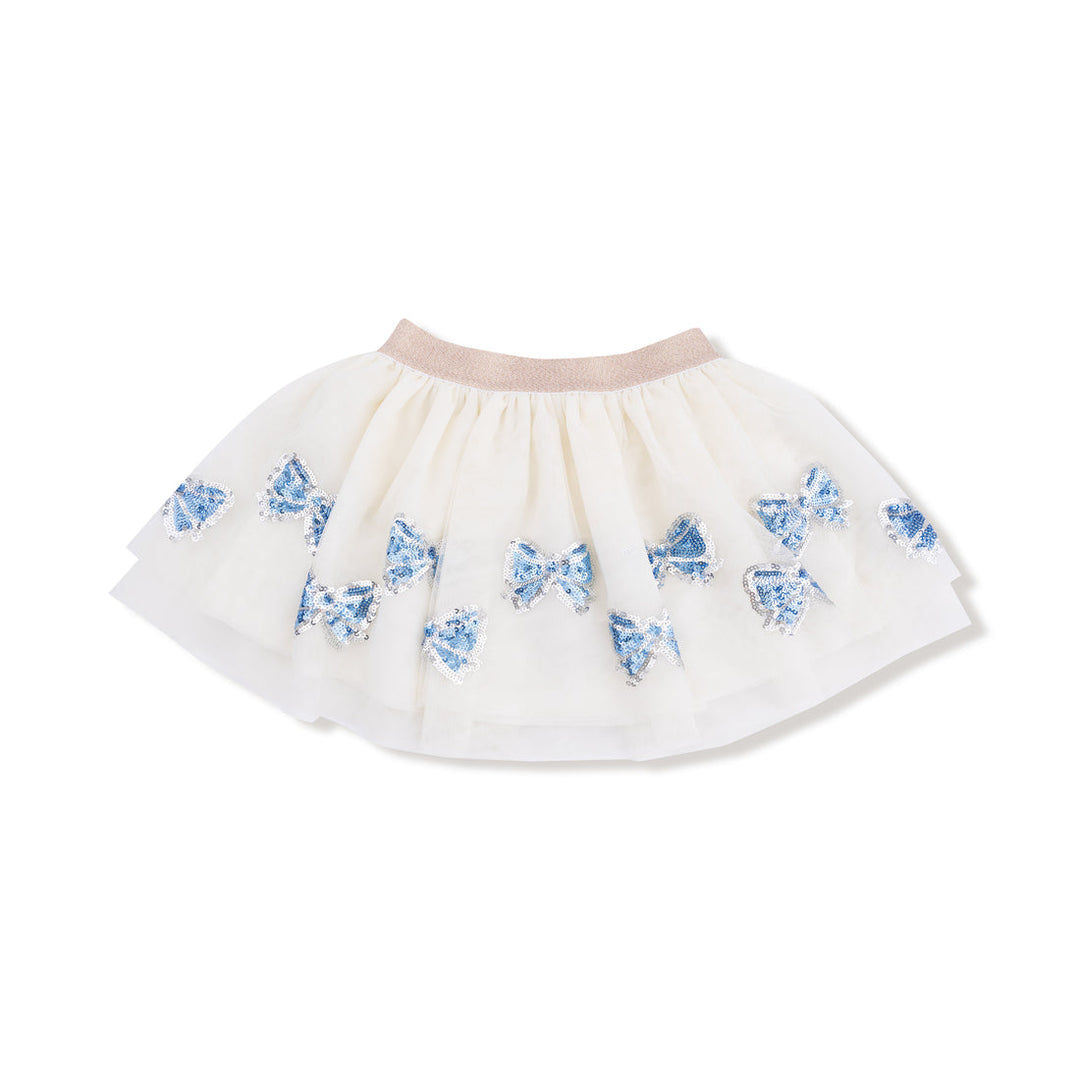 White skirt with blue sequin bows along the bottom patterns on a white background