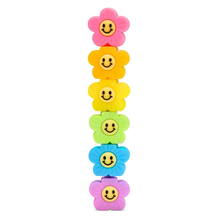 stackable markers shaped like flowers with smiley face centers. 