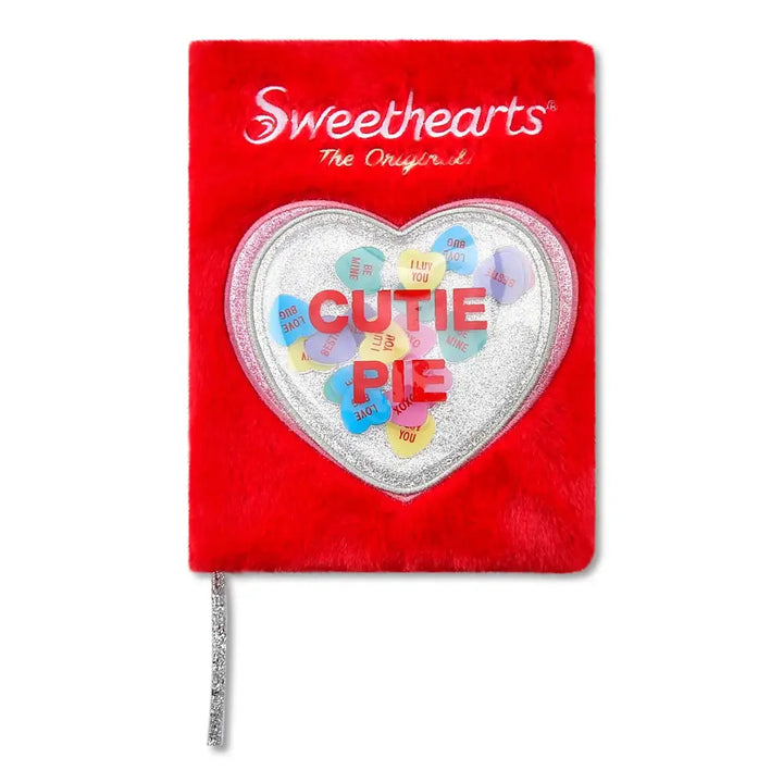 Red notebook with a heart-shaped cutout featuring colorful letters and 'Sweethearts' branding on a white background.