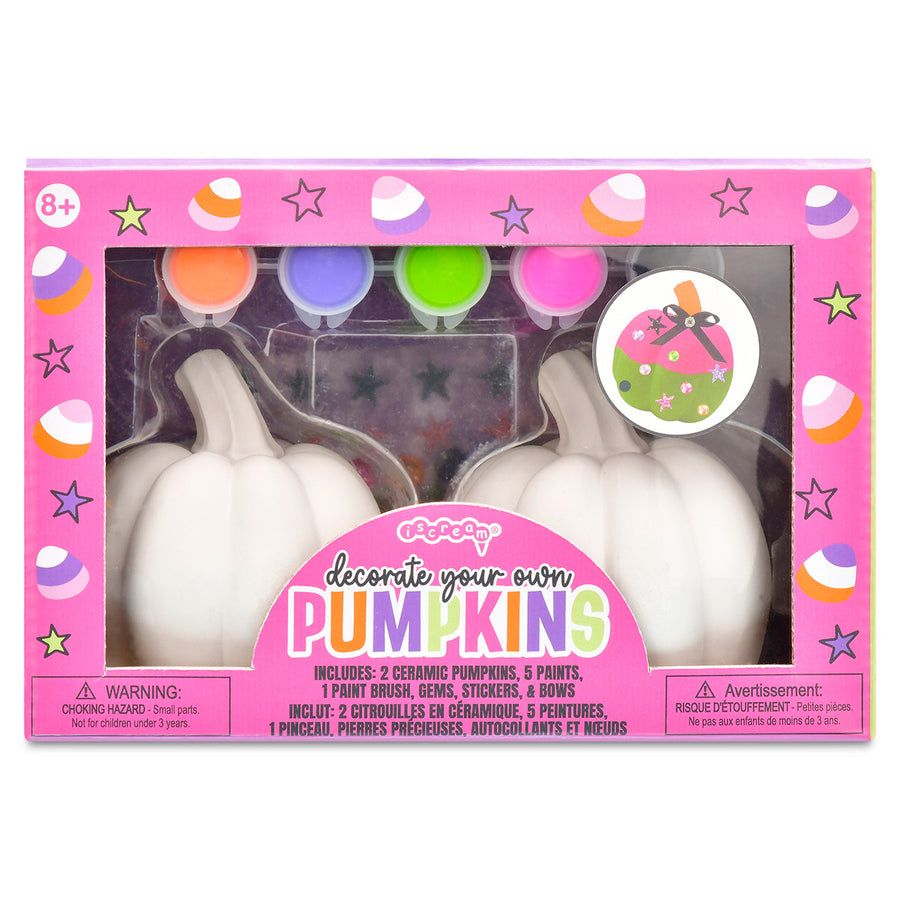 Ceramic pumpkin decorating kit with pink packaging on a white background