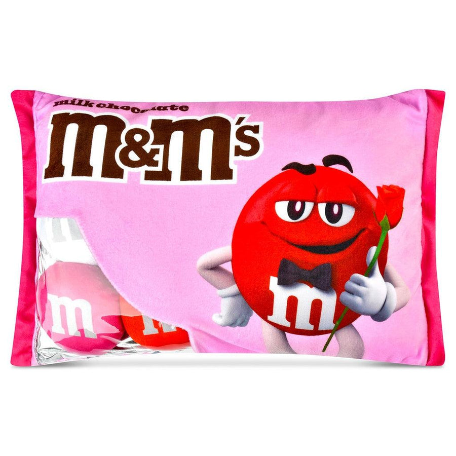 plush m and m's in valentines packaging. the bag is a pink color with a red m and m holding a rose. 3 plush m and ms come inside the package. 