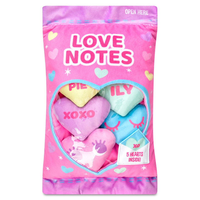 plush conversation hearts in a plush bag. PInk and purple in color. hearts are all multicolored. 