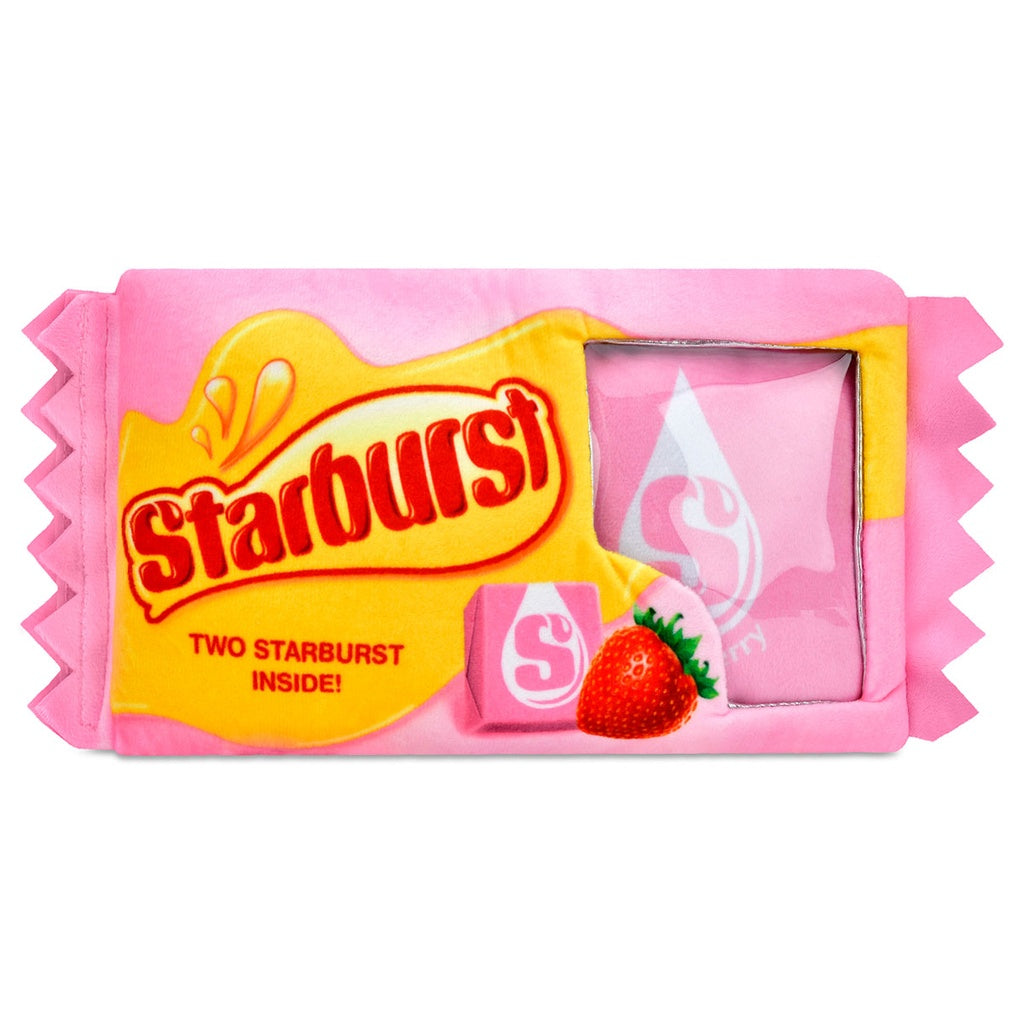 Pink Starburst candy wrapper with yellow label on a white background