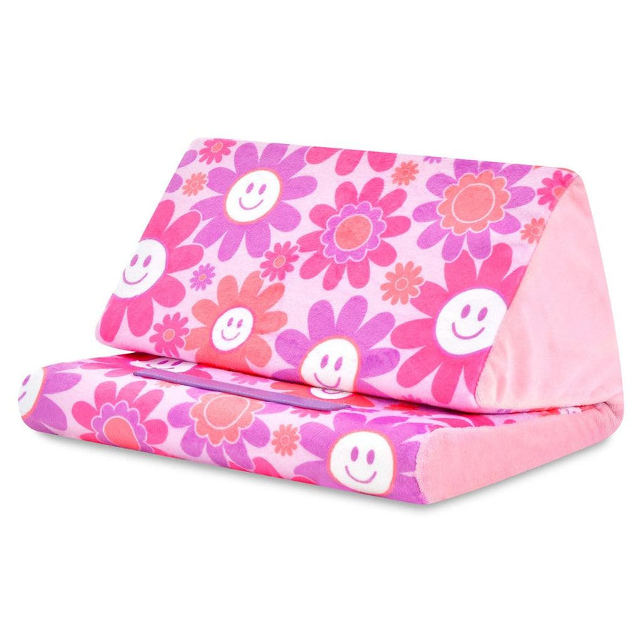 tablet pillow with pink background and big daisies and smiley faces all over it. pink, purple and orange smiley faces. 