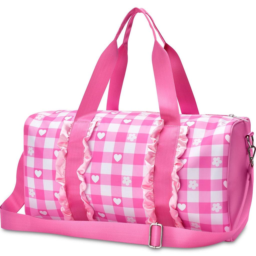 pink and white gingham duffle bag with pink shoulder straps and handles. 