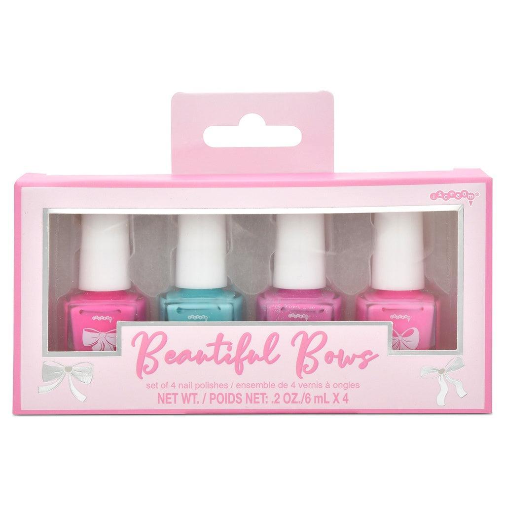 set of nail polishes in gift packaging: pink, pink sparkle, teal, light pink sheer. 