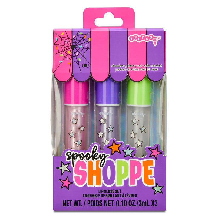 Spooky Shoppe lip gloss set packaging with three lip glosses in pink, purple, and green on a white background.