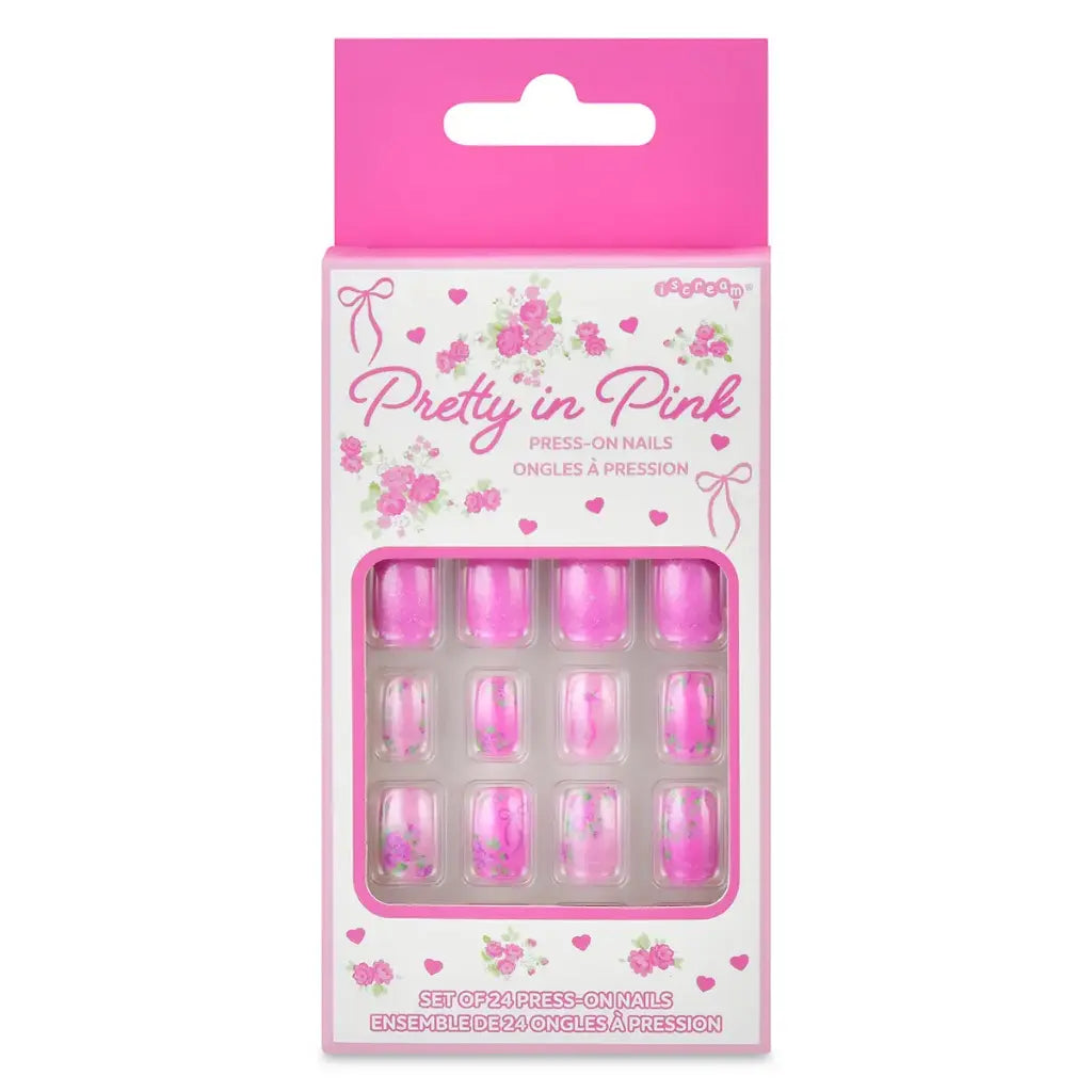 Pack of press-on nails with pink packaging featuring 'Pretty in Pink' text and floral designs.